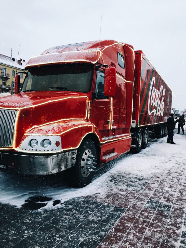 red-coca-cola-truck-parked-on-snow-covered-road-3961932